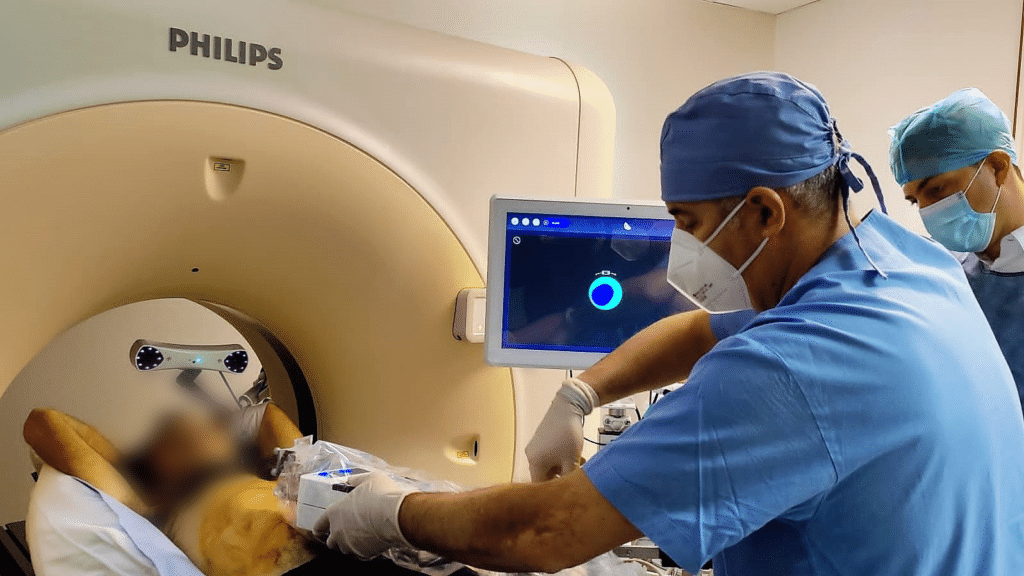 Dr. Filippiadis during a CT-guided biopsy using Micromate robot